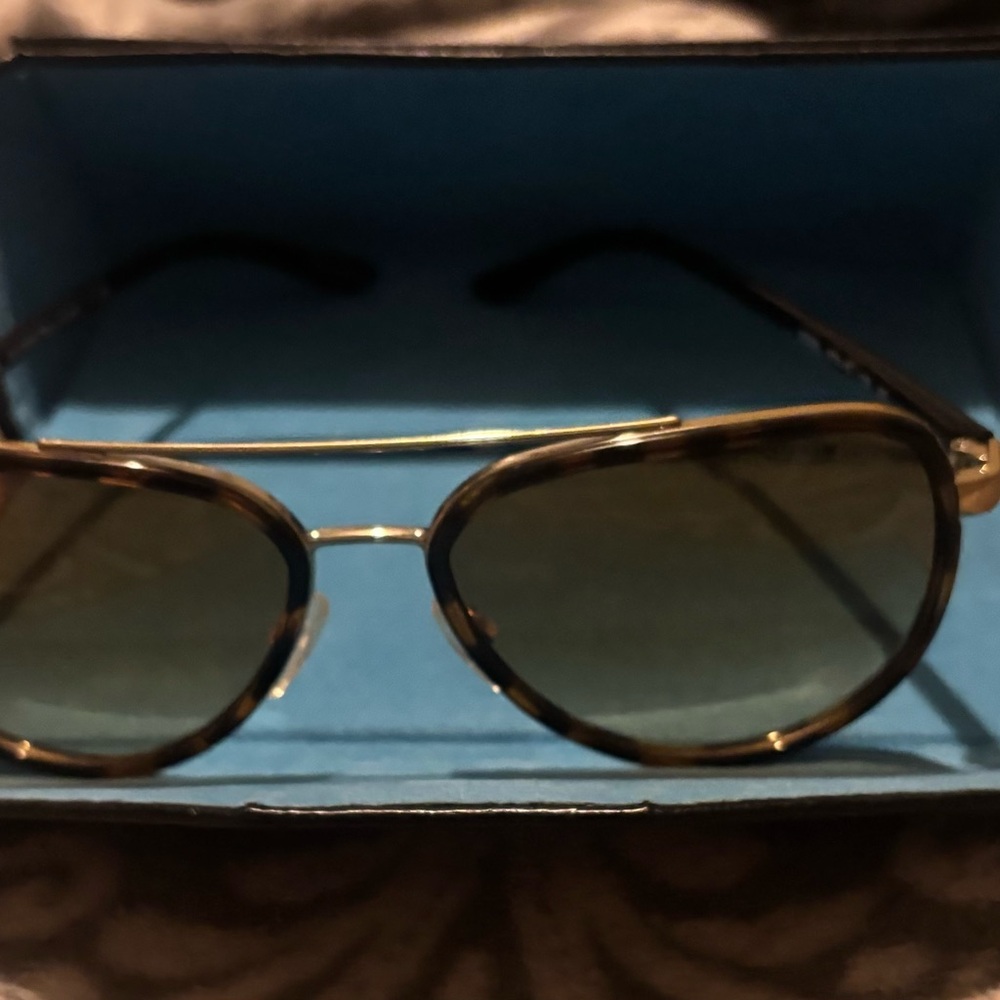 Michael Kors Left lens has a small scratch but not noticeable.